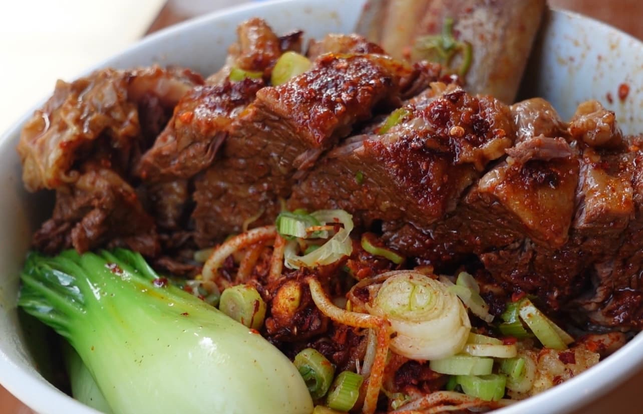 Papa Noodle beef short rib with chilli-oil noodles and greens