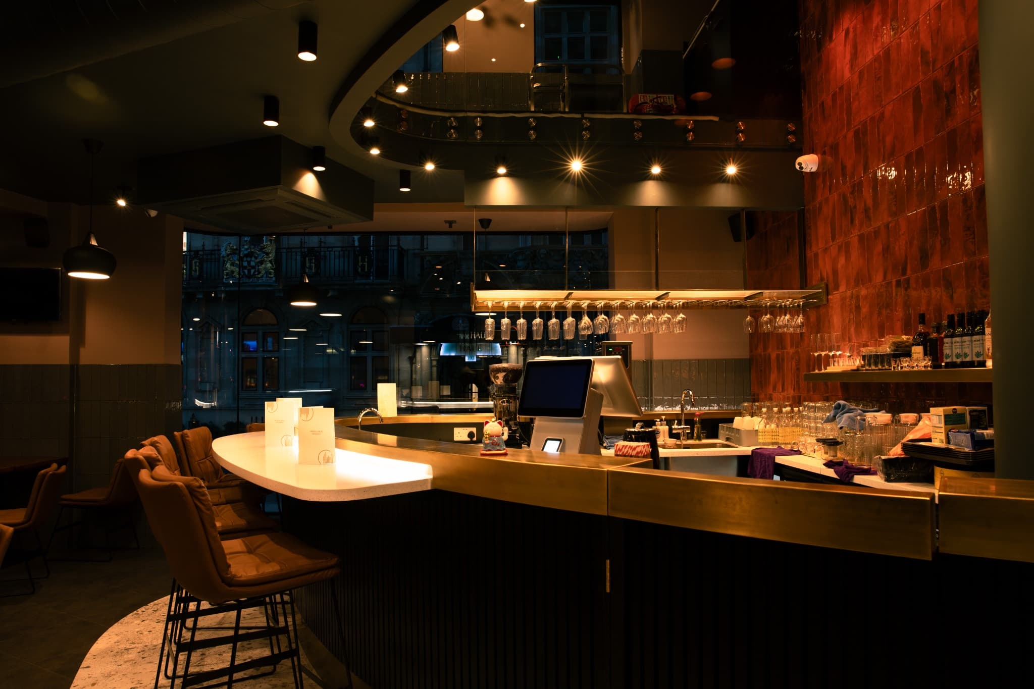 Warm lighting and welcoming counter inside Papa Noodle